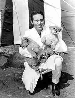 Dave Hoover with lion cubs